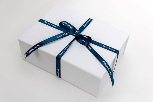 White gift box with a blue ribbon