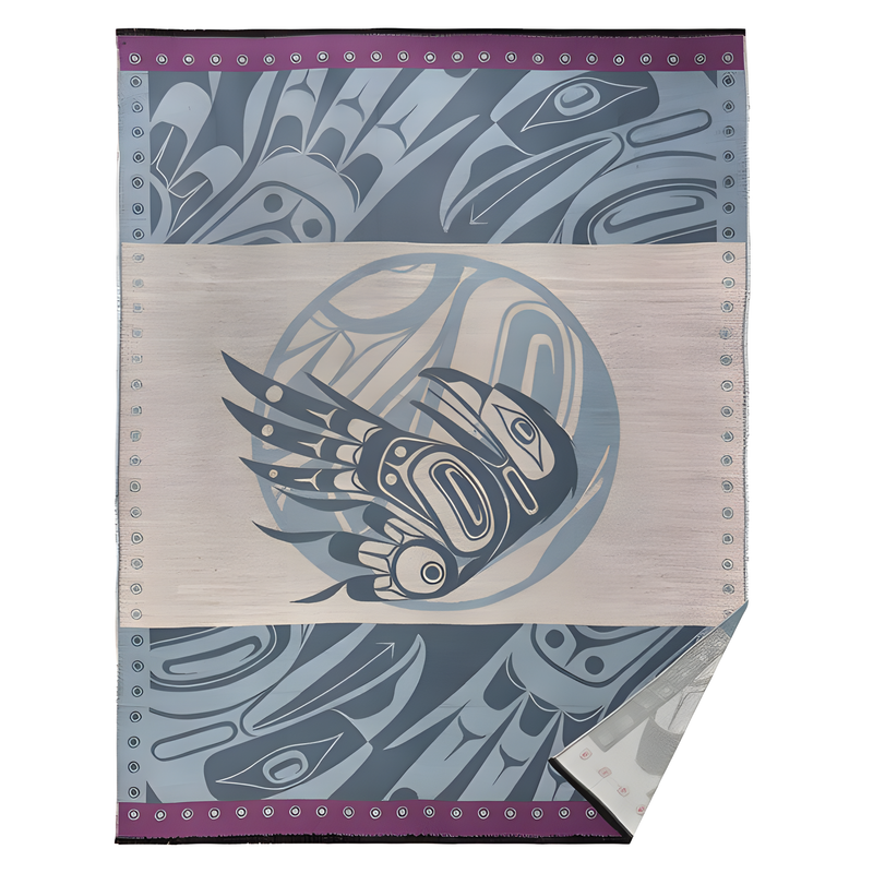 Woven blanket with blue highlights and a purple trim and an Indigenous eagle design