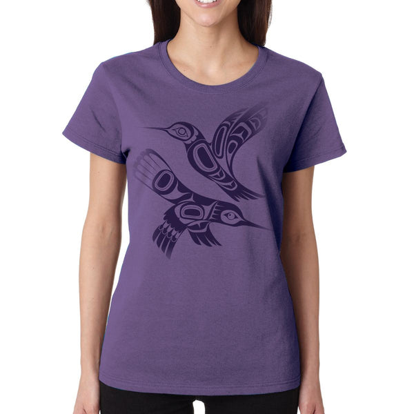 Person wearing a purple t-shirt with a bird design