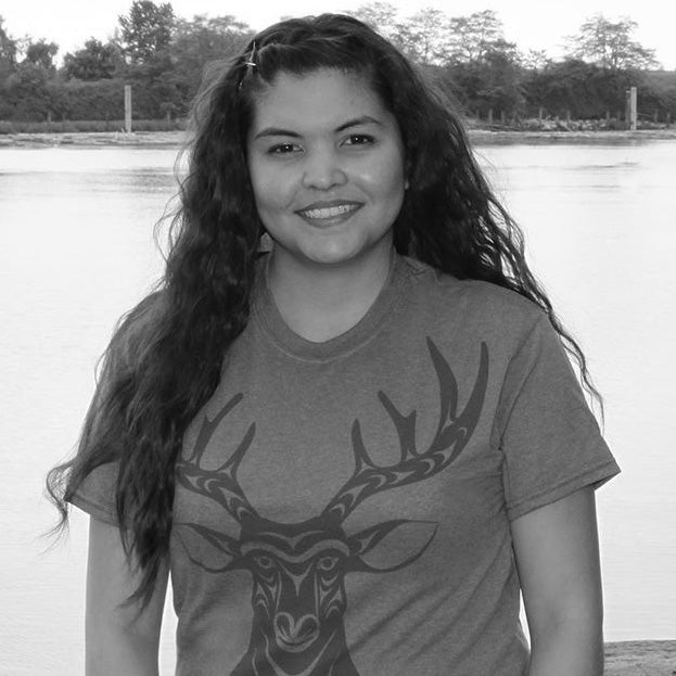 Coast Salish artist Simone Diamond wearing an Indigenous design deer shirt
