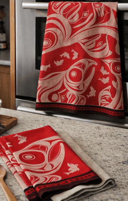 Salmon Tea Towel Draping over the Oven Handle and a Folded Salmon Tea Towel Laid Flat on the Kitchen Counter