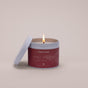 Candle in a red container labeled 'Raven Song Basket of Berries' 