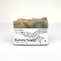 RavenSong Beachcomber artisan soap bar with a cream and teal top, wrapped in a white label with Northwest Coast formline raven art