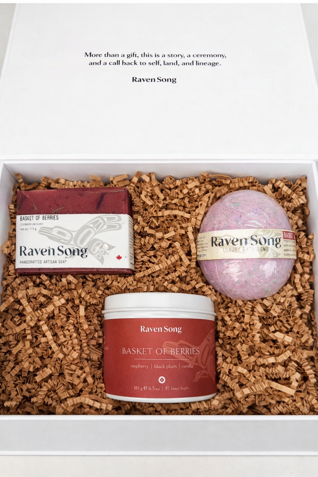 White basket of berries gift box from RavenSong containing a Basket of Berries soap, candle and bath bomb. Stuffed with eco friendly filler.
