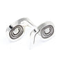 Sterling silver wolf stud earrings with oxidized spiral centres, designed by Danika Saunders