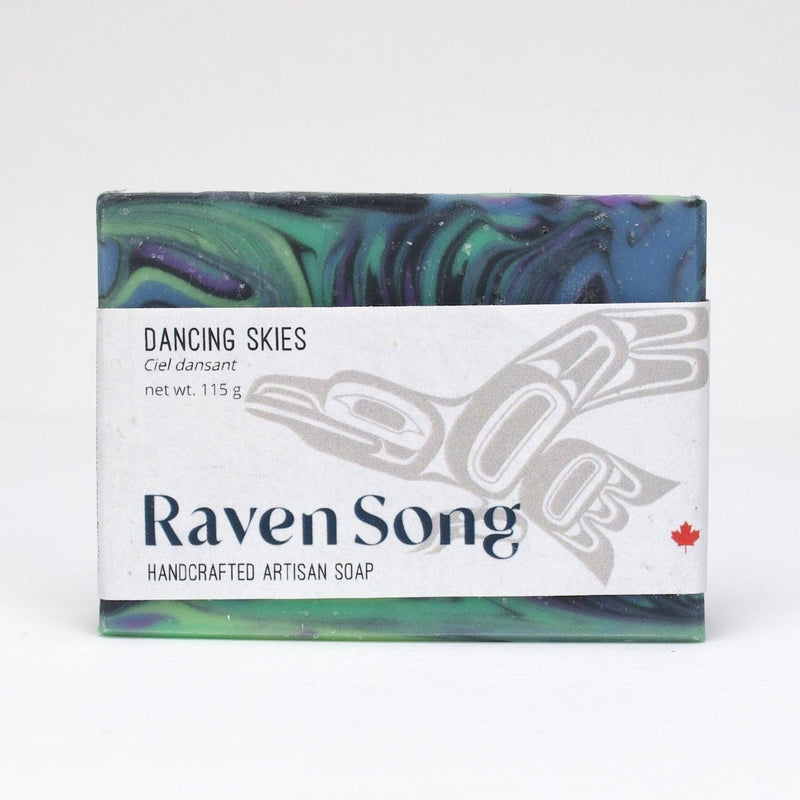 RavenSong Dancing Skies soap bar with a green, blue and purple northern-lights swirl, wrapped in a white RavenSong label