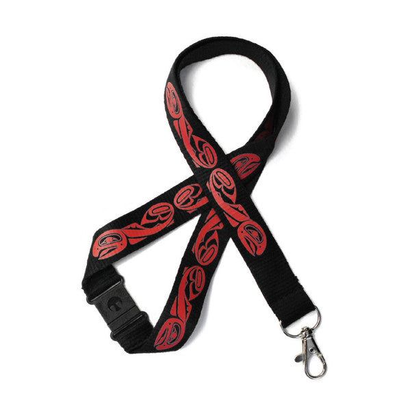 Photo of Lanyard with Salmon artwork by Indigenous Artist Paul Windsor displayed in front. of a white background