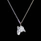 Silver Indigenous whale design-shaped pendant on a chain against a black background