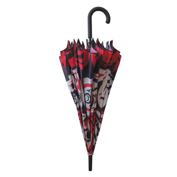 Pacific Umbrella Thunder Moon by Indigenous Artist Joe Wilson-Sxwaset folded into its compact size displayed in front of a white background