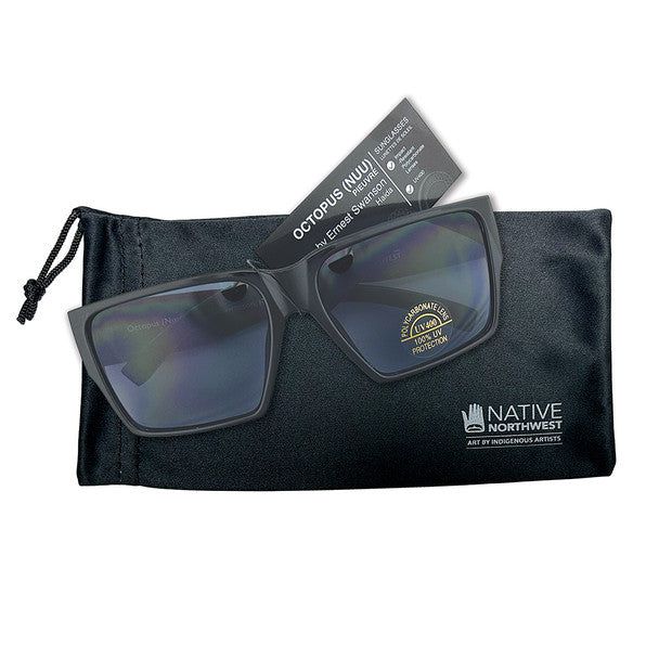 Octopus sunglasses by Indigenous Artist Ernest Swanson displayed on top of sunglasses case