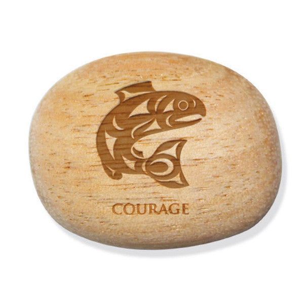 Photo of Indigenous Design Salmon by Maynard Johnny Jr engraved into a small wood stone with the word "COURAGE" engraved at the bottom. Displayed in front of a white background