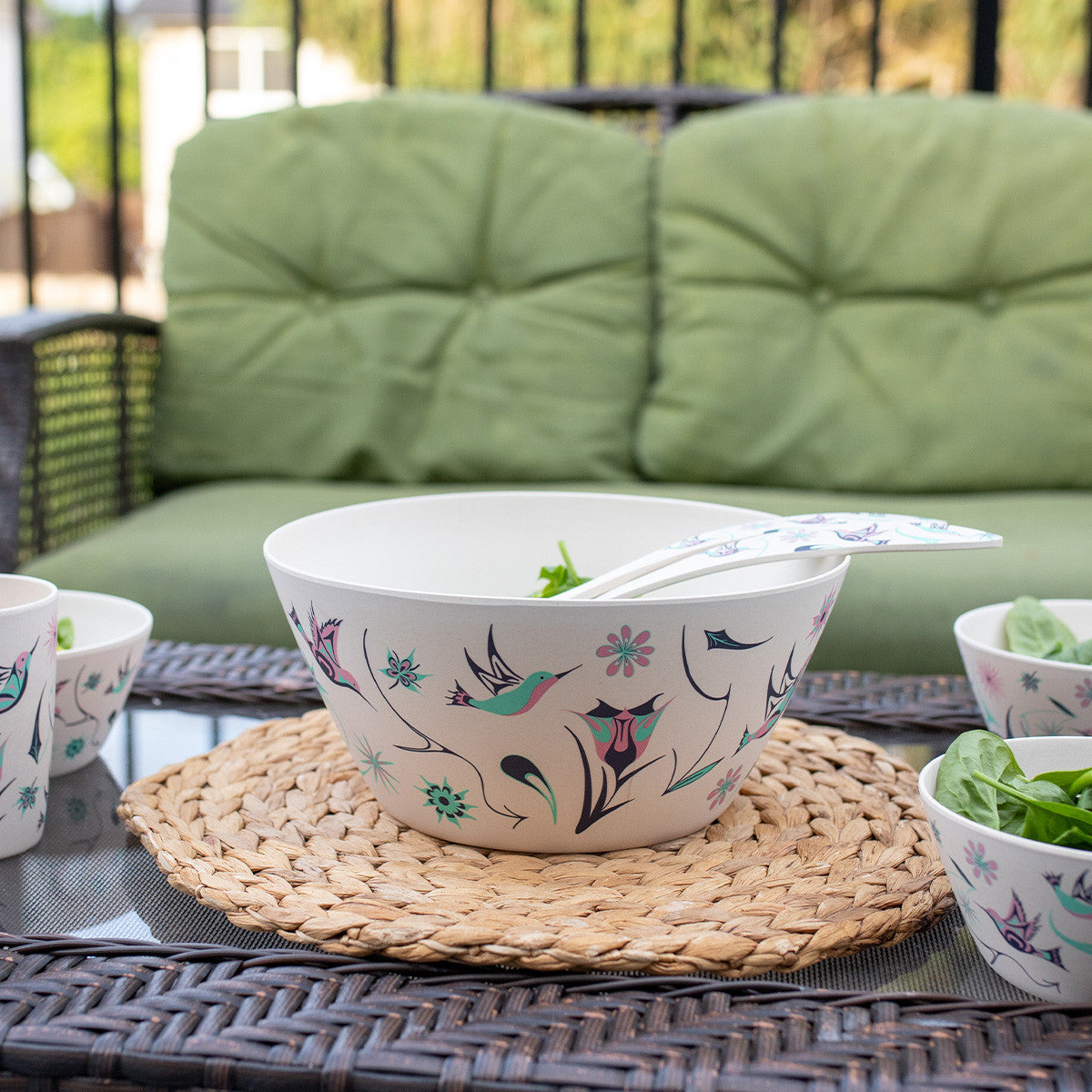 Decorative bowl with Indigenous bird and floral design on a table in a living room