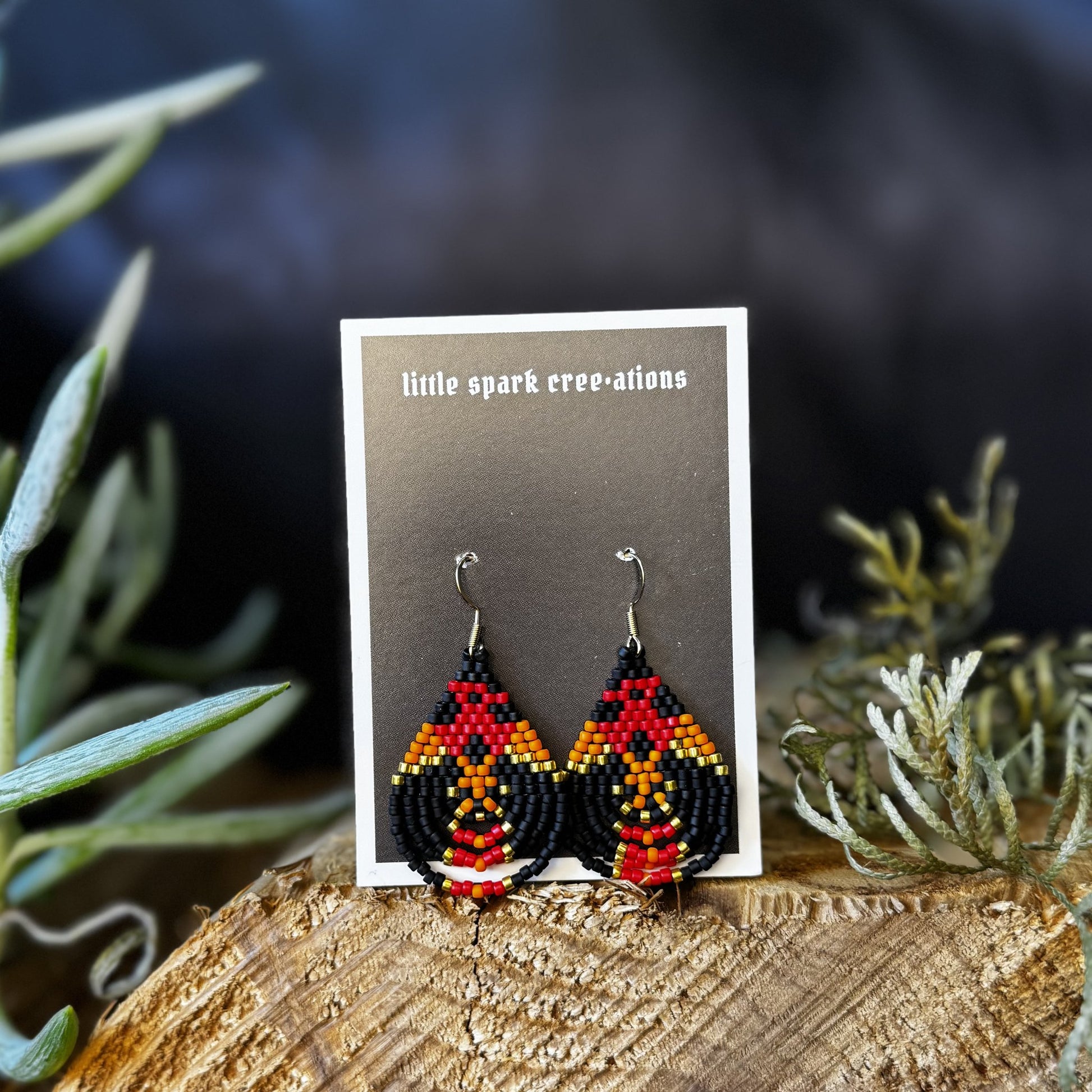 Red and Orange Flame medium beaded earrings handmade by Dee Cochrane of Little Spark Cree-ations