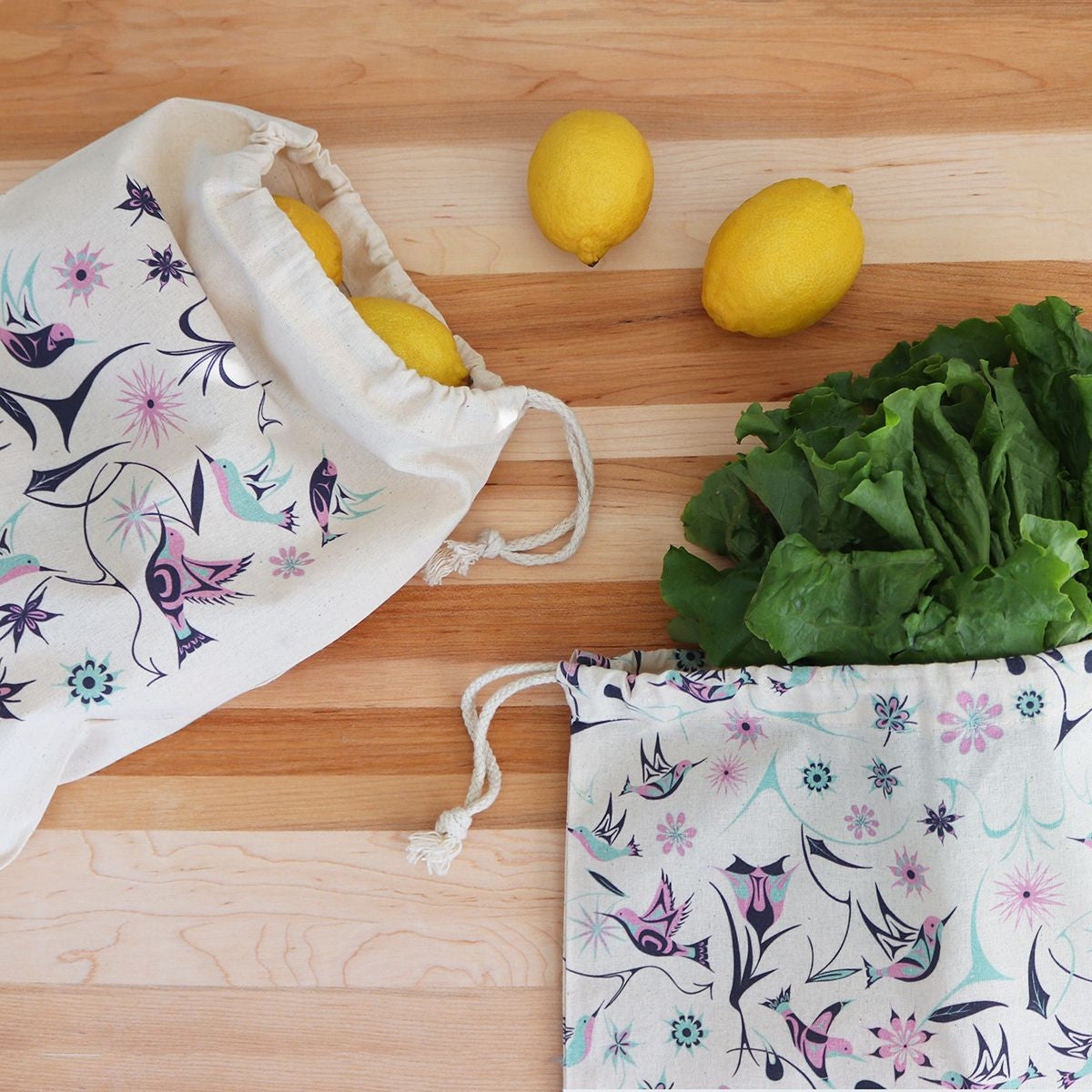 Reusable produce bags with Hummingbirds design by Nicole La Rock, shown filled with produce