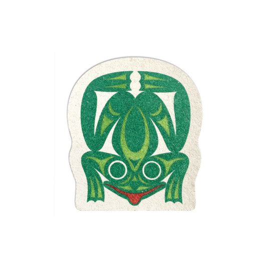 Frog-shaped eco sponge with a green front-facing frog and red mouth designed by Maynard Johnny Jr. on a natural sponge