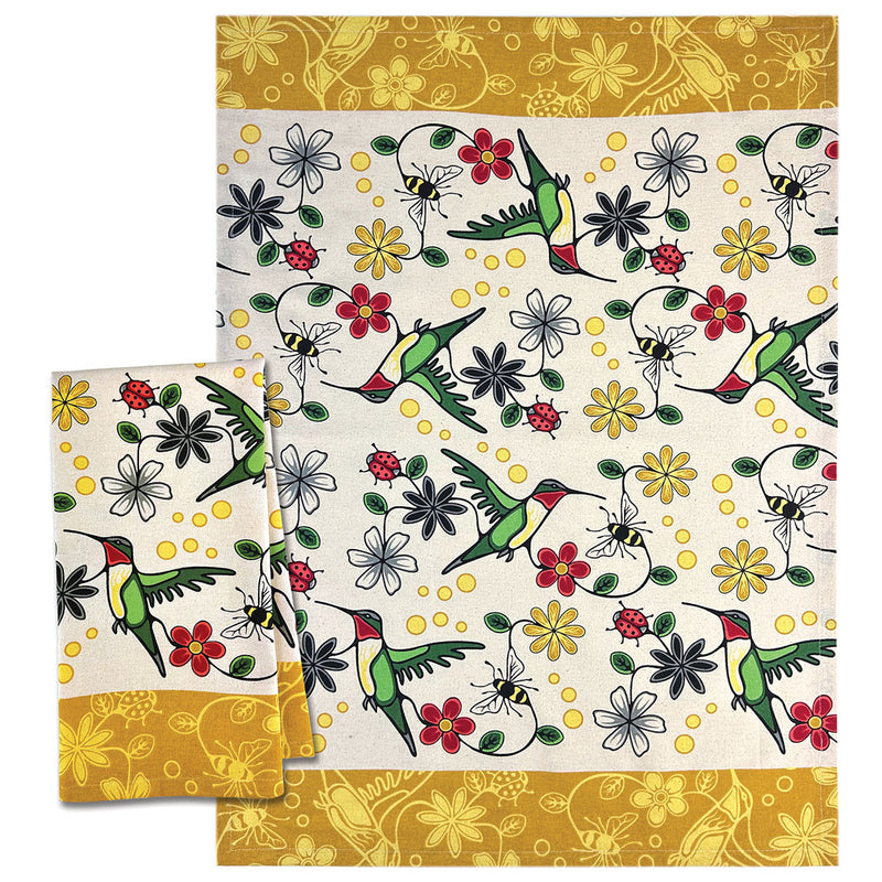 Natural cotton tea towel with green hummingbirds, red and grey flowers, bees and ladybugs, with golden-yellow patterned borders, designed by Storm Angeconeb