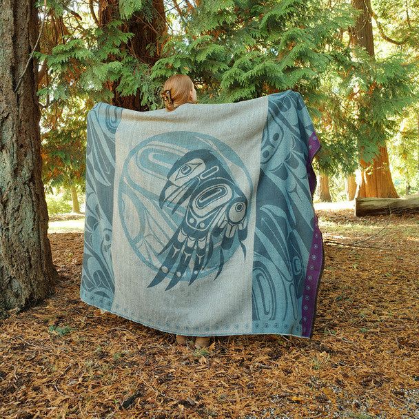 Holding Raven Woven Blanket in the Woods