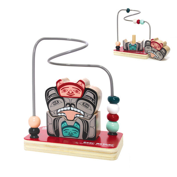 Wooden toy with Indigenous bear design and colourful beads