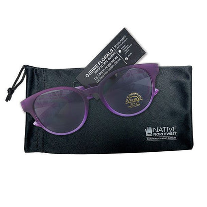 Purple glasses florals by Storm Angeconeb laying on top. of glasses case