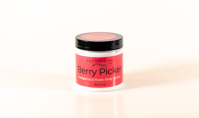 Sweetgrass Soap Berry Picker body butter in a clear jar with a black lid, 118 ml.