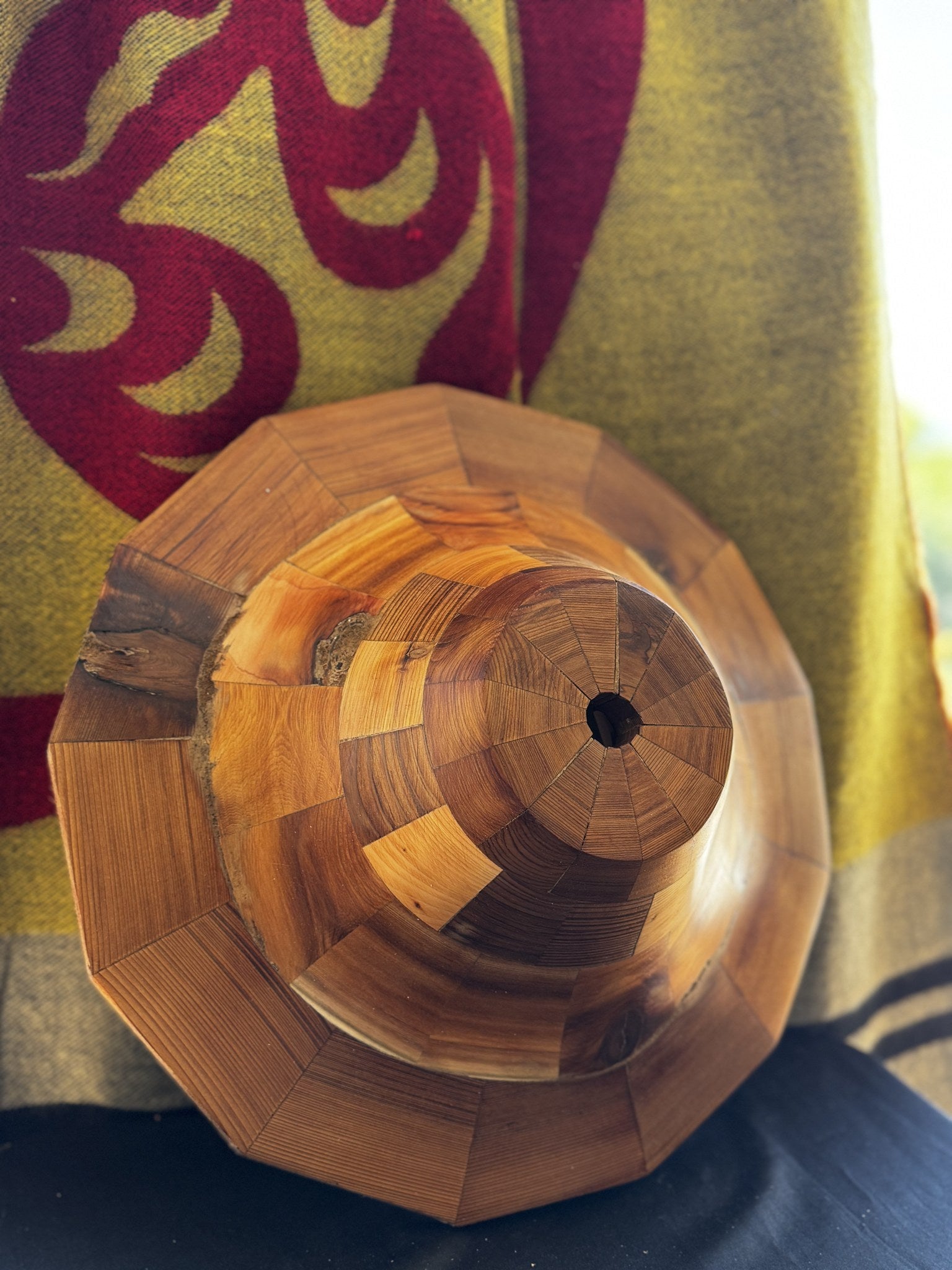 Close detail of the cedar hat form crown and peg hole showing wood grain