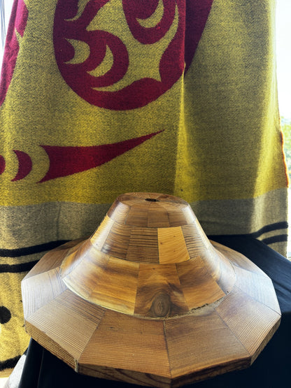 Side view of the cedar hat form showing stacked cedar block construction and grain
