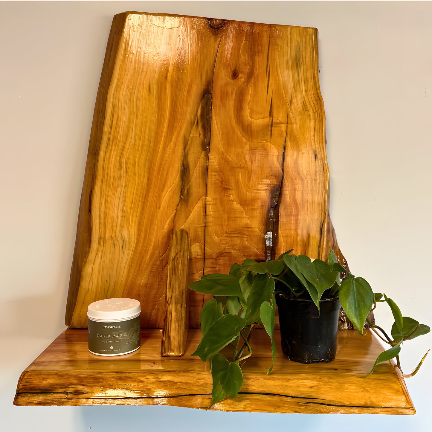 Wooden cedar live edge shelf with a plant and candle