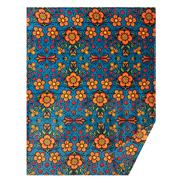 Prairie Beadwork fleece blanket by Justine Proulx, Métis artist, featuring a vibrant floral beadwork design