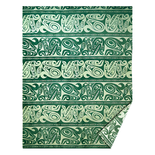 Green fleece blanket with Indigenous designed wolf print