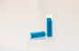 Sweetgrass Soap Deadly Uncle lip balm twist-up tube with a blue label, two shown.