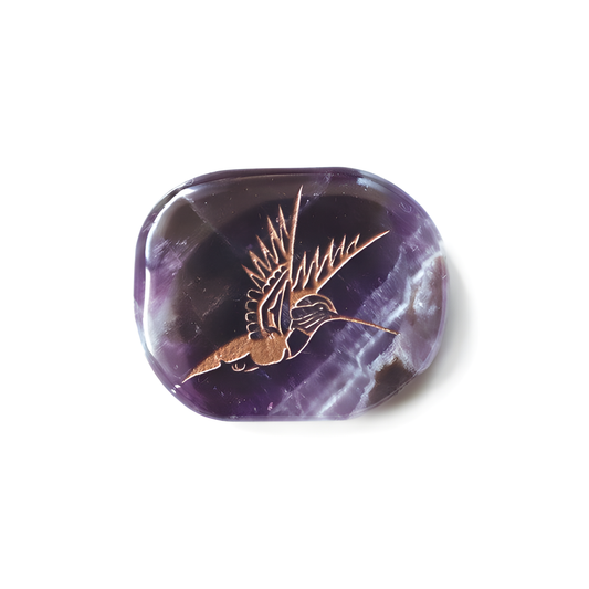 Amethyst stone with an Indigenous hummingbird etched into the piece