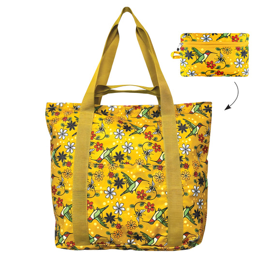 Yellow tote bag with hummingbird and floral pattern with it's feature foldable pouch displayed
