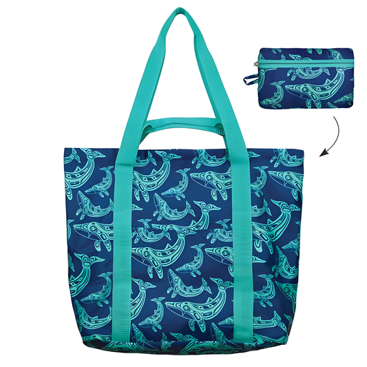 Blue tote bag with folded pouch option featured and Indigenous whale design