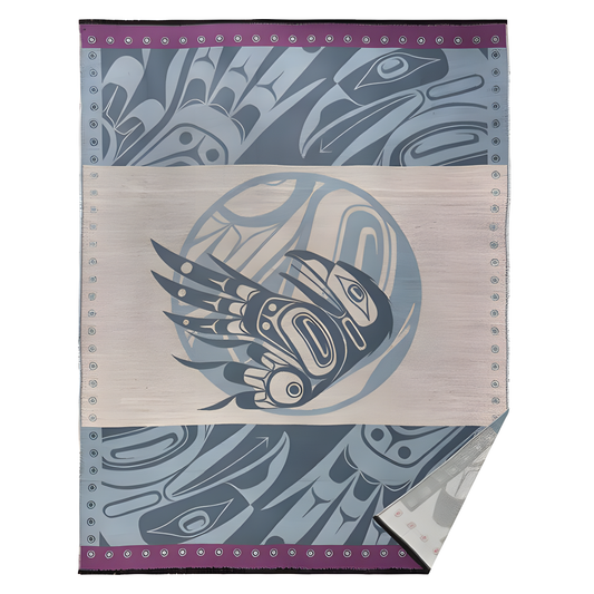 Woven blanket with blue highlights and a purple trim and an Indigenous eagle design