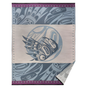 Woven blanket with blue highlights and a purple trim and an Indigenous eagle design