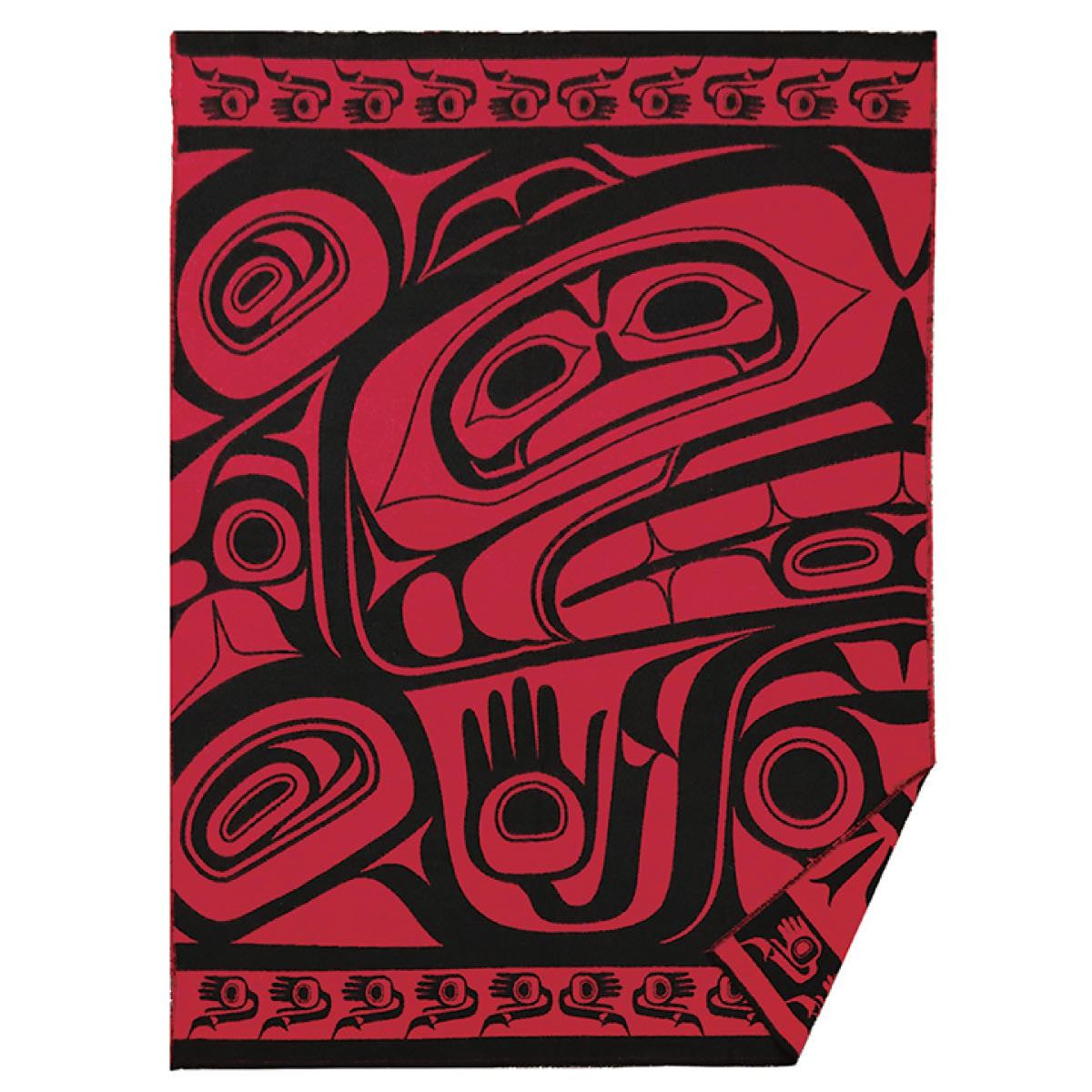 Red and black Treasure of Our Ancestors woven blanket with Haida design by Donnie Edenshaw, displayed flat with detail