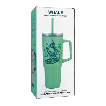A mint green insulated tumbler with a handle and straw, featuring a dark teal whale graphic, shown in its white retail box labeled 'WHALE by Paul Windsor”