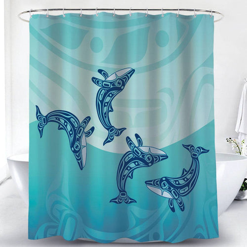 Shower curtain with whale design on a blue and green gradient background