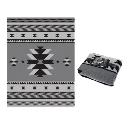 Gray and black patterned blanket with a geometric design