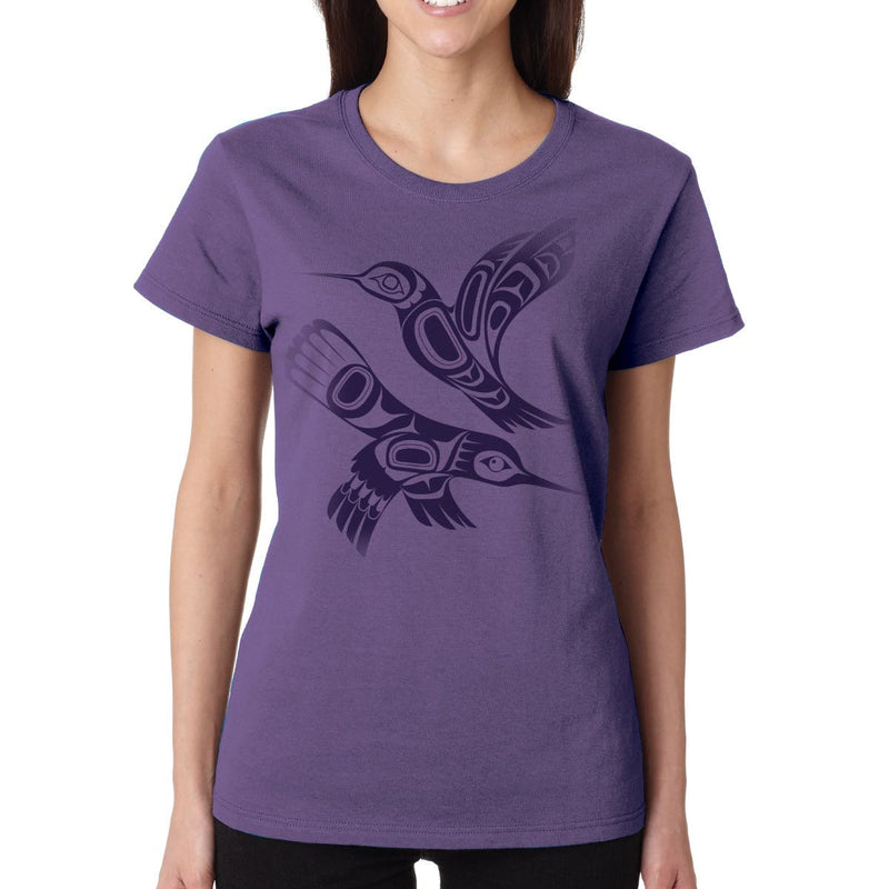 Person wearing a purple t-shirt with a bird design
