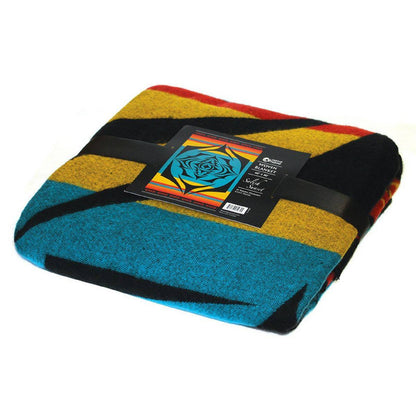 Colourful folded blanket with a brand label